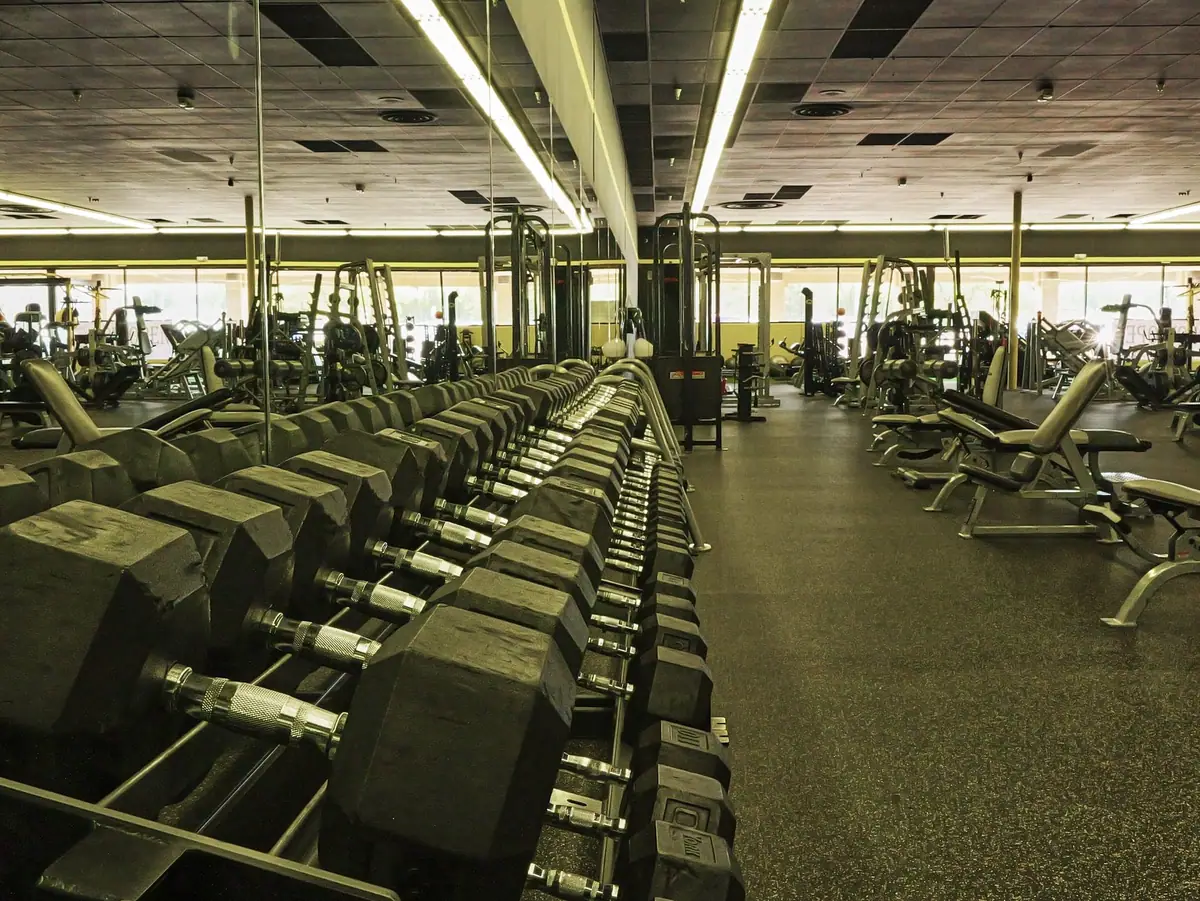 Dumbbells and strength equipment on the floor at Bee Fit North Cincinnati